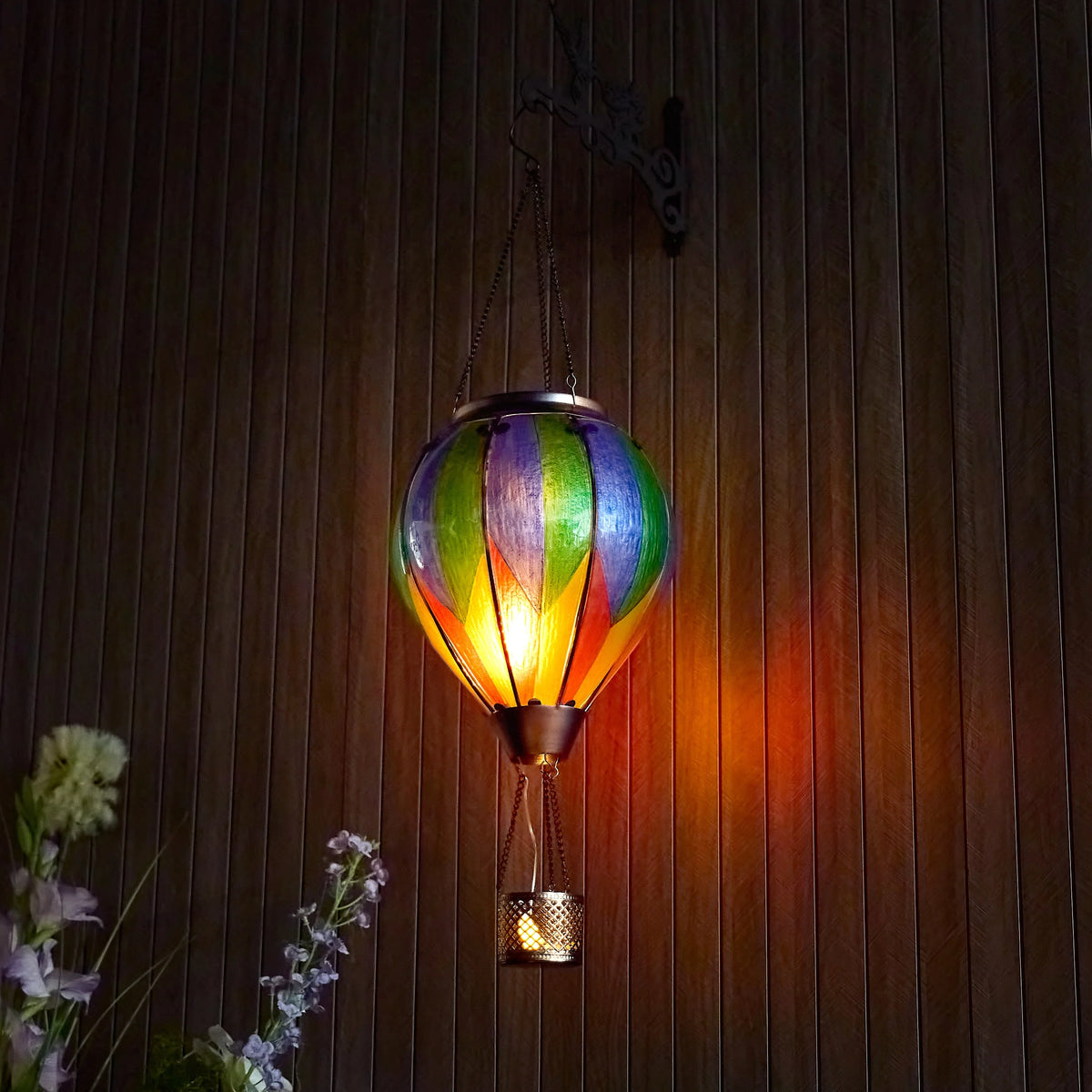 colorful hot air balloon solar lantern used as ambient patio decor, ideal for evening gatherings