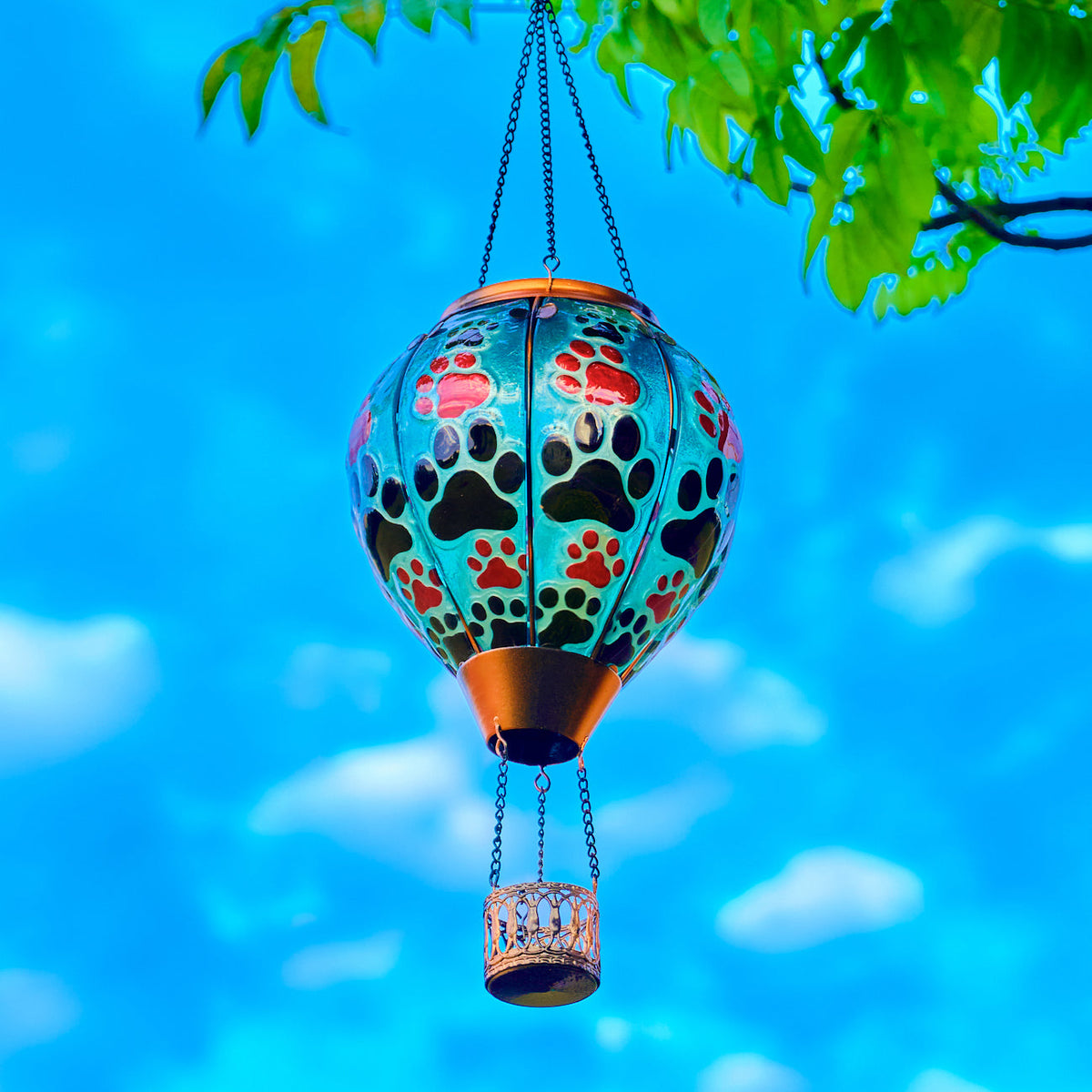 Balloon-shaped solar lantern designed for pet lovers, featuring paw prints and ideal for backyard solar garden lighting